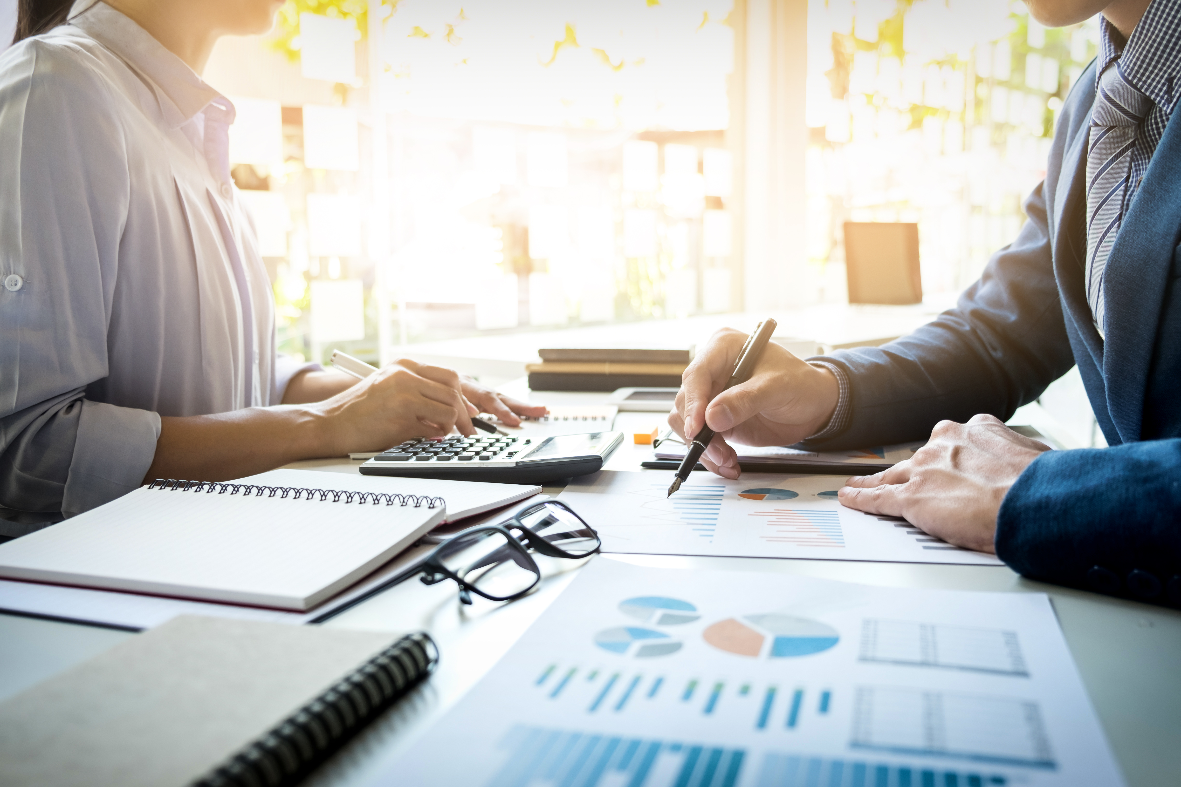 business man financial inspector and secretary making report, ca business man financial inspector and secretary making report, calculating or checking balance. Internal Revenue Service inspector checking document. Audit concept